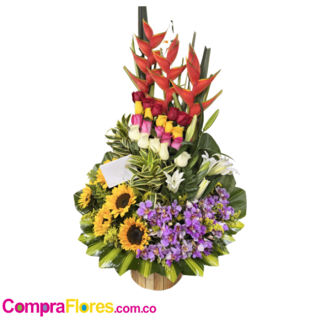Diseño floral en base con 7 girasoles, 12 rosas y 10 claveles.